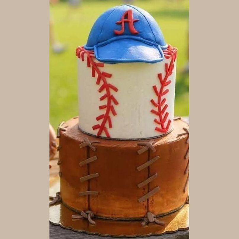 Two-tier baseball cake with a glove-stitched base, baseball tier and blue cap